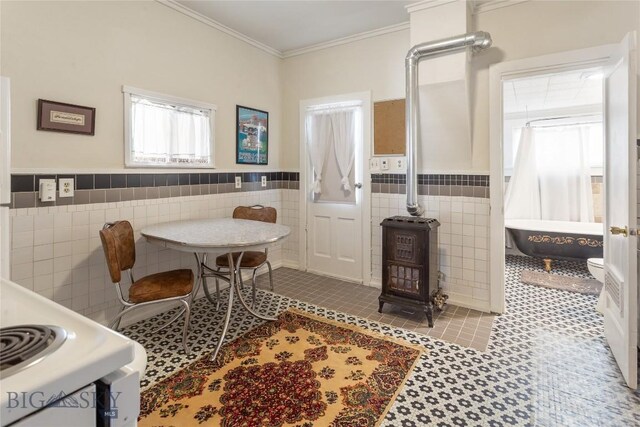 1116-1118 California St, Butte, MT 59701 - dining area with tile walls, a wainscoted wall, crown molding, and tile patterned flooring