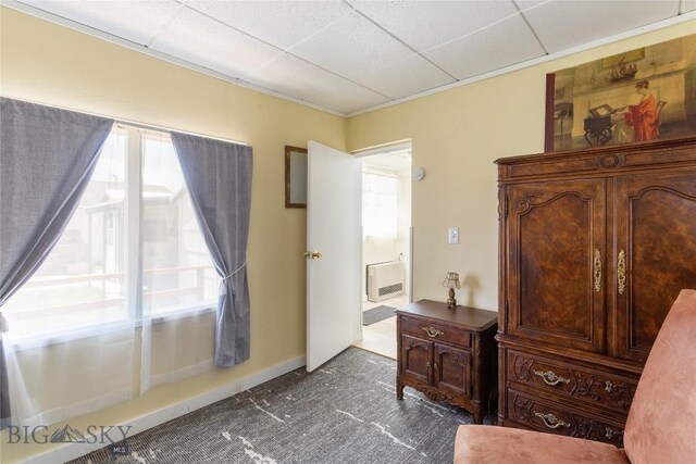 1116-1118 California St, Butte, MT 59701 - interior space with dark colored carpet, multiple windows, a paneled ceiling, and heating unit