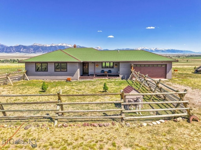 25 Trail Creek Rd, Ennis, MT 59729 - ranch-style home featuring dirt driveway, a garage, a mountain view, and a porch