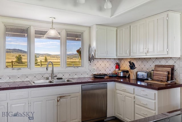 25 Trail Creek Rd, Ennis, MT 59729 - kitchen with a sink, dark countertops, stainless steel dishwasher, and white cabinets