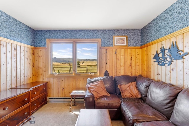 25 Trail Creek Rd, Ennis, MT 59729 - living area featuring wallpapered walls, a baseboard heating unit, wooden walls, and carpet floors