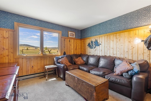 25 Trail Creek Rd, Ennis, MT 59729 - living area featuring a baseboard radiator, carpet flooring, wallpapered walls, and wood walls