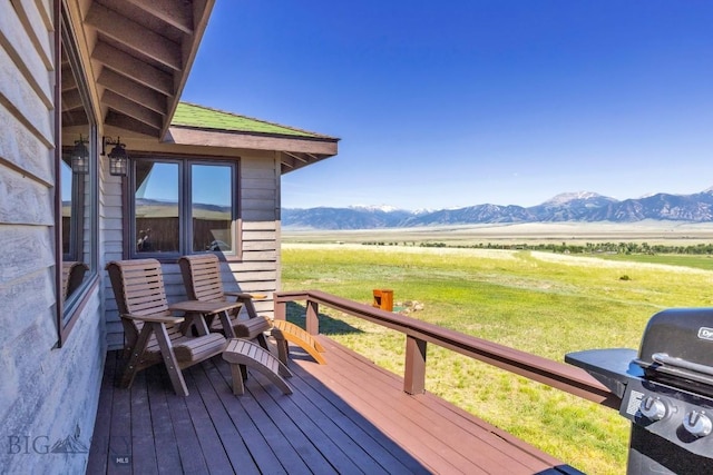 25 Trail Creek Rd, Ennis, MT 59729 - wooden deck featuring a mountain view, a rural view, and a lawn