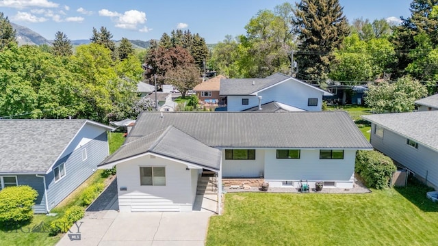 420 N 6th Ave, Bozeman, MT 59715 - view of front of property with a front lawn, concrete driveway, and metal roof