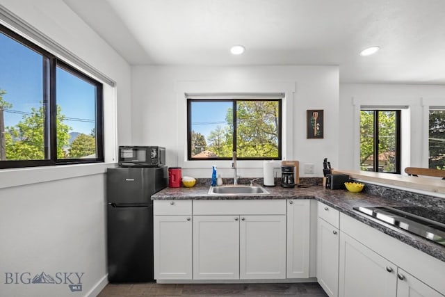 420 N 6th Ave, Bozeman, MT 59715 - kitchen with freestanding refrigerator, a sink, cooktop, white cabinets, and recessed lighting