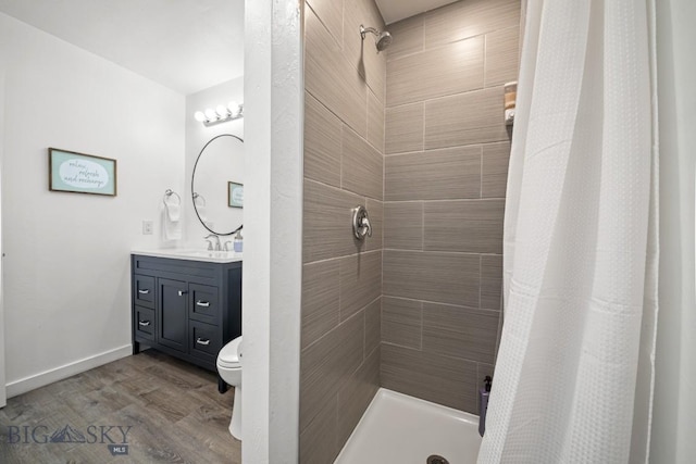 420 N 6th Ave, Bozeman, MT 59715 - bathroom featuring vanity, a tile shower, and wood finished floors