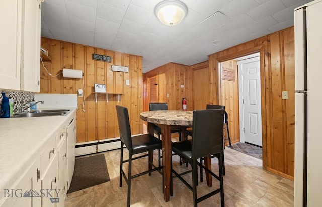 420 N 6th Ave, Bozeman, MT 59715 - dining space with wooden walls and baseboard heating