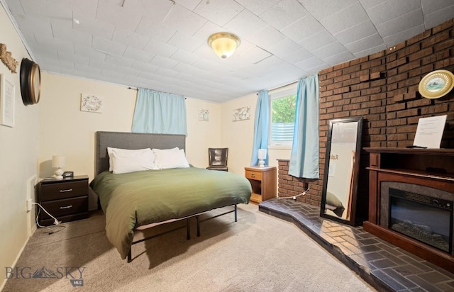 420 N 6th Ave, Bozeman, MT 59715 - bedroom featuring brick wall, carpet floors, and a glass covered fireplace