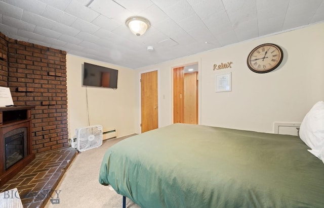 420 N 6th Ave, Bozeman, MT 59715 - bedroom featuring carpet flooring, a baseboard radiator, and a glass covered fireplace