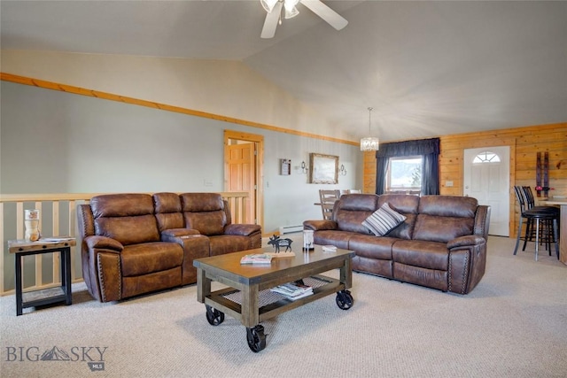 13 Coachman Ln, Mcallister, MT 59740 - carpeted living room featuring ceiling fan, lofted ceiling, and wood walls