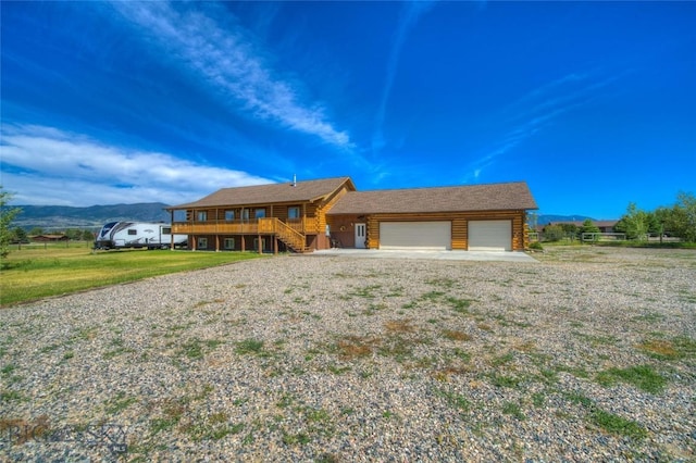 13 Coachman Ln, Mcallister, MT 59740 - cabin with a garage, stairway, a front yard, and a deck with mountain view