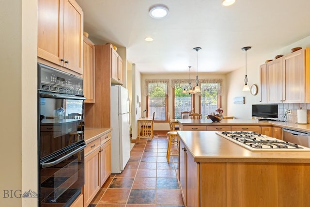 510 N 23rd, Bozeman, MT 59718 - kitchen with freestanding refrigerator, a peninsula, decorative backsplash, gas cooktop, and recessed lighting