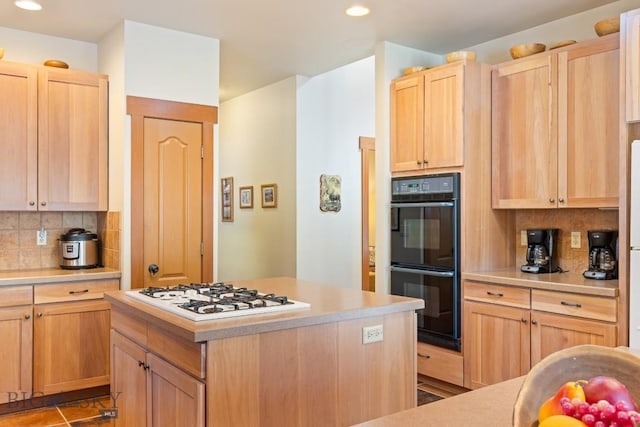 510 N 23rd, Bozeman, MT 59718 - kitchen featuring white gas stovetop, light brown cabinetry, tasteful backsplash, light countertops, and recessed lighting