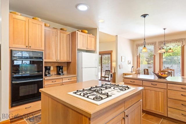 510 N 23rd, Bozeman, MT 59718 - kitchen with white appliances, light brown cabinetry, light countertops, and recessed lighting