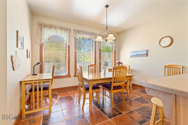 510 N 23rd, Bozeman, MT 59718 - dining space featuring a chandelier and baseboards