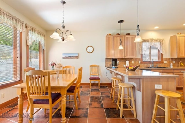 510 N 23rd, Bozeman, MT 59718 - dining room featuring a chandelier, baseboards, and recessed lighting