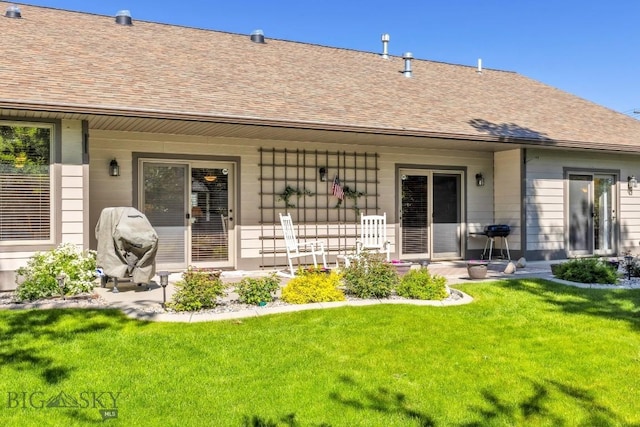 510 N 23rd, Bozeman, MT 59718 - rear view of house featuring a yard, roof with shingles, and a porch