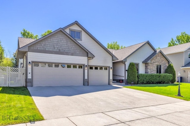 510 N 23rd, Bozeman, MT 59718 - craftsman inspired home with a garage, concrete driveway, and stone siding