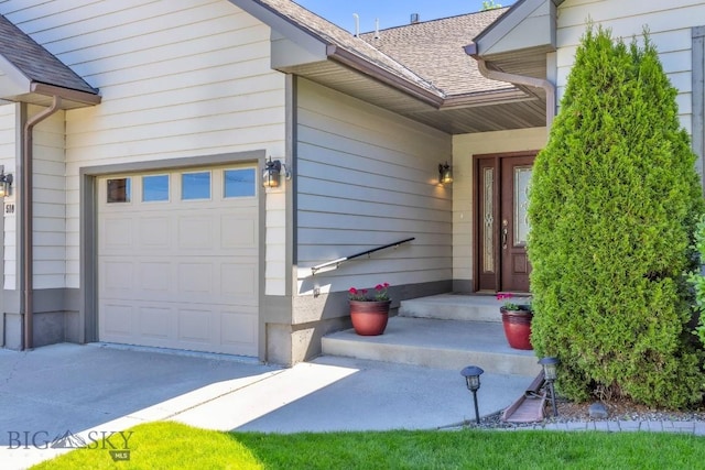 510 N 23rd, Bozeman, MT 59718 - view of exterior entry featuring a shingled roof and driveway