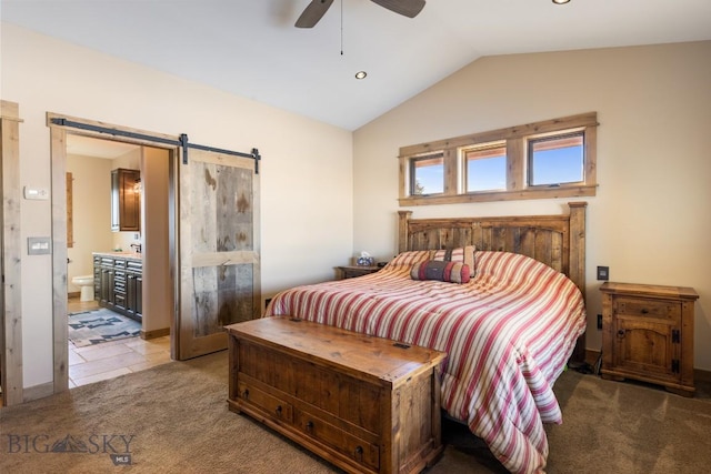 715 Bates Rd, Manhattan, MT 59741 - bedroom featuring lofted ceiling, light carpet, a barn door, ensuite bath, and ceiling fan