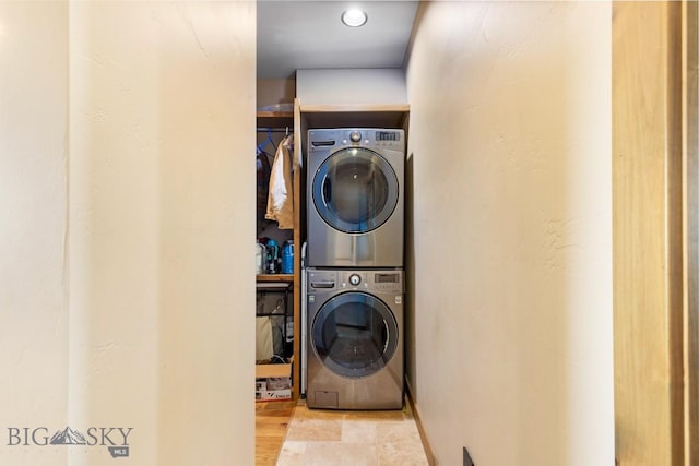 715 Bates Rd, Manhattan, MT 59741 - laundry area featuring stacked washing machine and dryer and baseboards