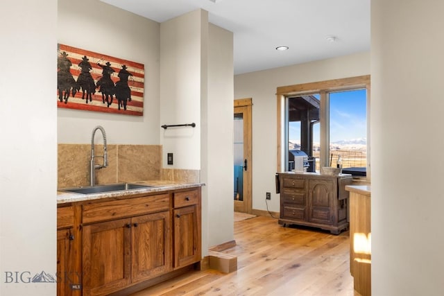 715 Bates Rd, Manhattan, MT 59741 - bar featuring a sink, light wood-style flooring, tasteful backsplash, and recessed lighting