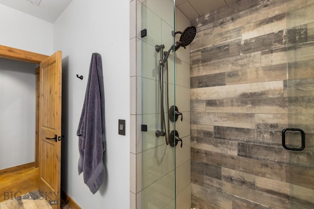 715 Bates Rd, Manhattan, MT 59741 - full bathroom featuring a stall shower and wood finished floors