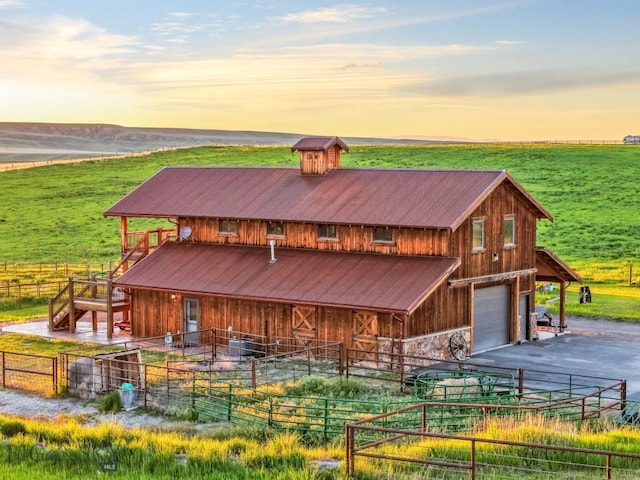 715 Bates Rd, Manhattan, MT 59741 - view of front of property with asphalt driveway, an exterior structure, a view of rural / pastoral area, and a garage