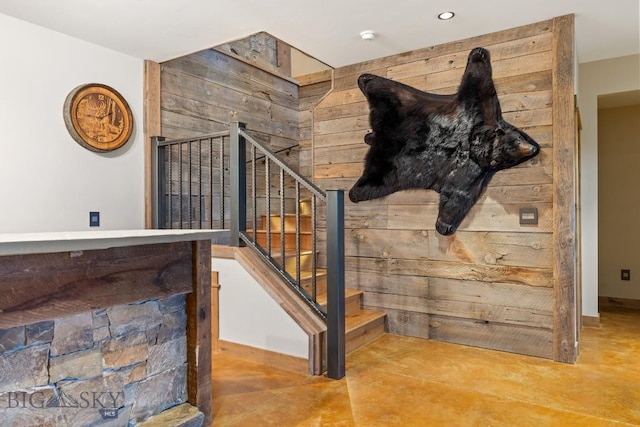 715 Bates Rd, Manhattan, MT 59741 - stairway featuring wooden walls, finished concrete flooring, and baseboards