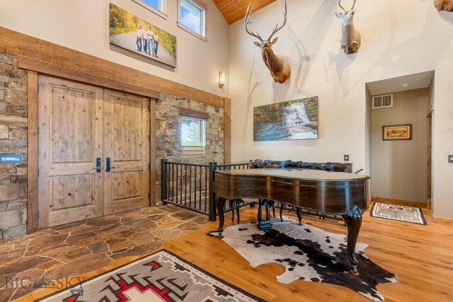 715 Bates Rd, Manhattan, MT 59741 - entrance foyer with high vaulted ceiling, wood finished floors, and plenty of natural light