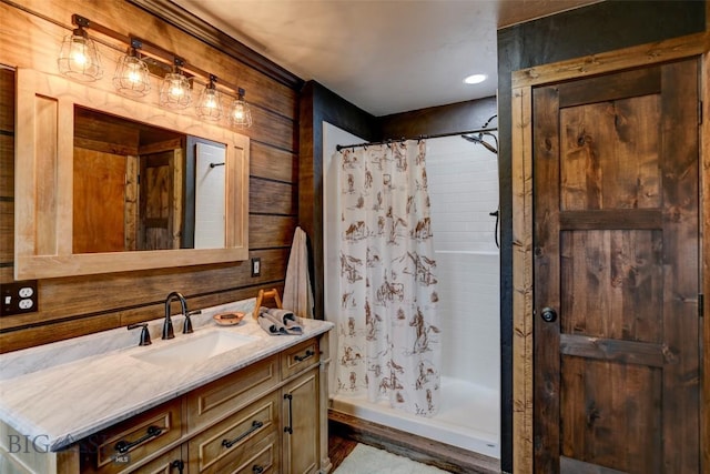 996 Forest Grove Rd, Lewistown, MT 59457 - full bath with vanity, curtained shower, wooden walls, and recessed lighting