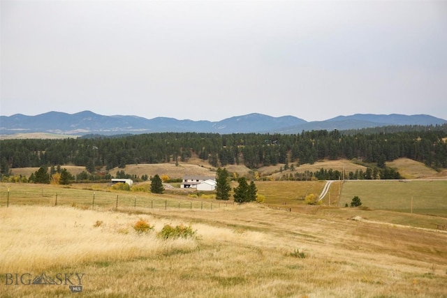 996 Forest Grove Rd, Lewistown, MT 59457 - view of mountain background with rural landscape and a heavily wooded area