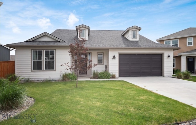1518 Deadwood Loop, Belgrade, MT 59714 - view of front facade featuring a garage, driveway, and a shingled roof