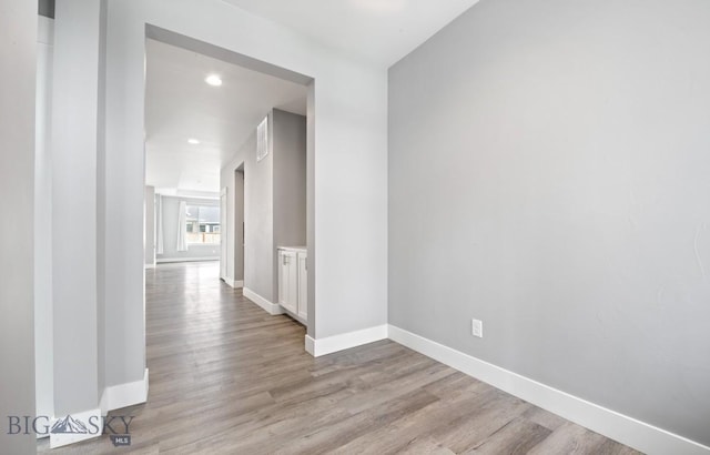1518 Deadwood Loop, Belgrade, MT 59714 - hallway featuring baseboards, light wood-style flooring, and recessed lighting