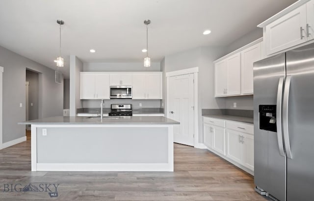 1518 Deadwood Loop, Belgrade, MT 59714 - kitchen with appliances with stainless steel finishes, a sink, white cabinetry, and recessed lighting