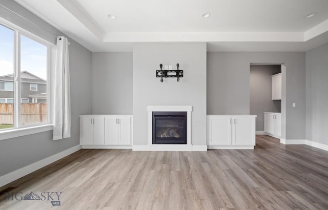 1518 Deadwood Loop, Belgrade, MT 59714 - unfurnished living room featuring plenty of natural light, light wood finished floors, baseboards, and recessed lighting