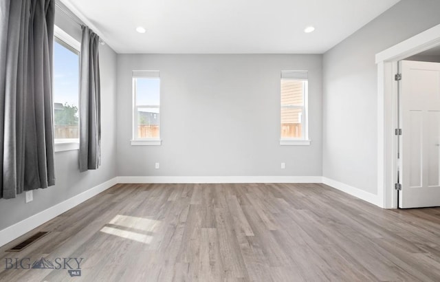 1518 Deadwood Loop, Belgrade, MT 59714 - empty room featuring wood finished floors, baseboards, and recessed lighting