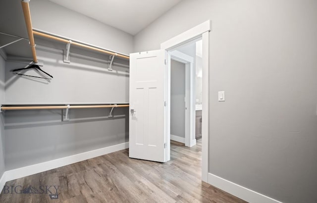 1518 Deadwood Loop, Belgrade, MT 59714 - walk in closet featuring wood finished floors