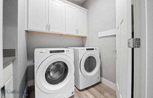 1518 Deadwood Loop, Belgrade, MT 59714 - laundry room featuring cabinet space, separate washer and dryer, light wood-style flooring, and baseboards