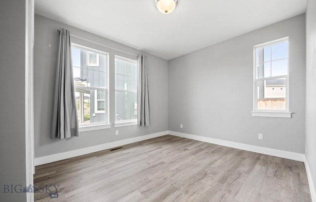 1518 Deadwood Loop, Belgrade, MT 59714 - spare room with wood finished floors and baseboards