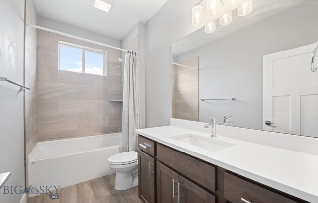1518 Deadwood Loop, Belgrade, MT 59714 - full bath featuring vanity, wood finished floors, shower / tub combo with curtain, and toilet