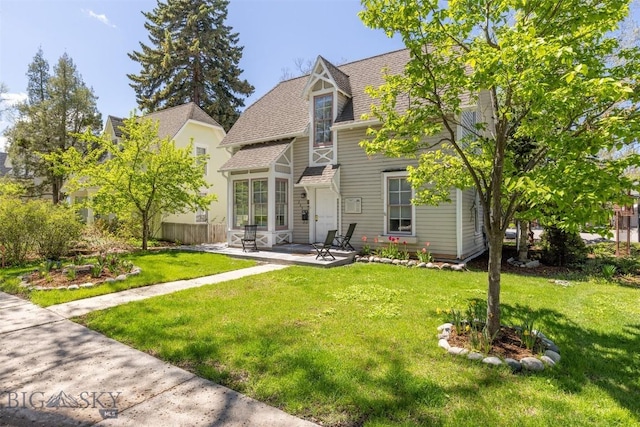 209 S Tracy, Bozeman, MT 59715 - rear view of house with a patio area, a yard, and roof with shingles