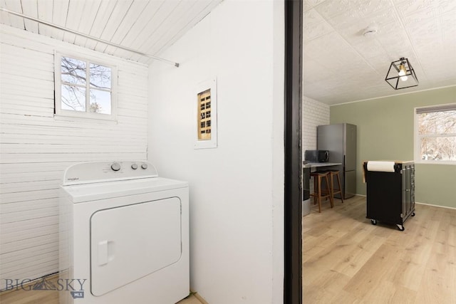 209 S Tracy, Bozeman, MT 59715 - washroom featuring washer / dryer and light wood-type flooring