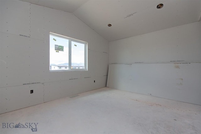 500 Spaniel Ln, Belgrade, MT 59714 - spare room featuring vaulted ceiling