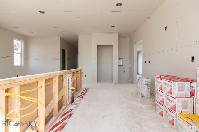 500 Spaniel Ln, Belgrade, MT 59714 - hall featuring unfinished concrete floors