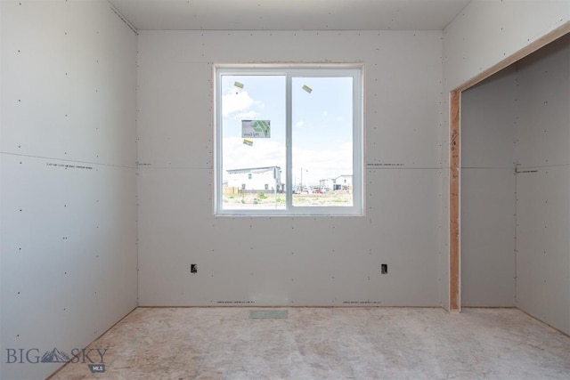 500 Spaniel Ln, Belgrade, MT 59714 - unfurnished bedroom featuring multiple windows