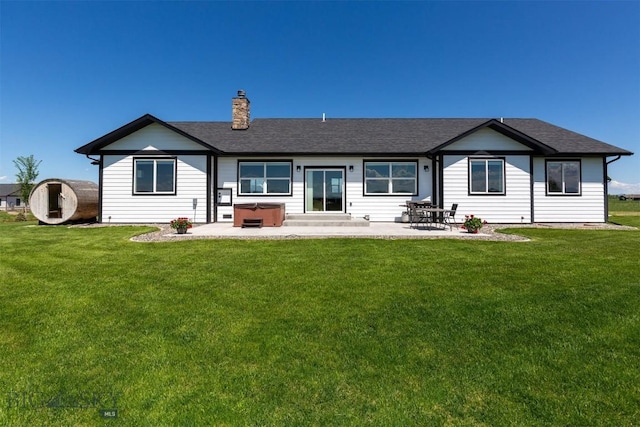 3483 Highline Rd, Manhattan, MT 59741 - rear view of property with a patio, a lawn, and a hot tub