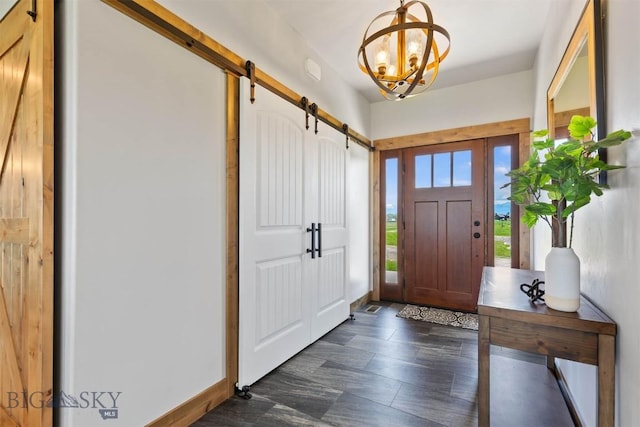 3483 Highline Rd, Manhattan, MT 59741 - foyer featuring a barn door, a chandelier, and baseboards