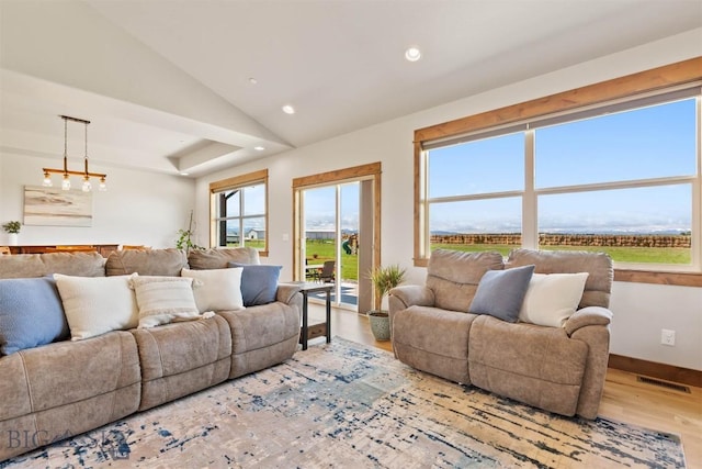 3483 Highline Rd, Manhattan, MT 59741 - living area featuring wood finished floors, recessed lighting, baseboards, and lofted ceiling
