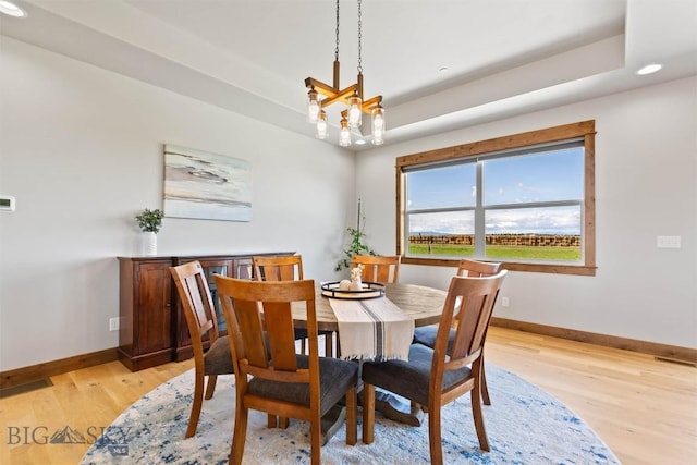 3483 Highline Rd, Manhattan, MT 59741 - dining area with baseboards, a chandelier, light wood-style floors, recessed lighting, and a raised ceiling